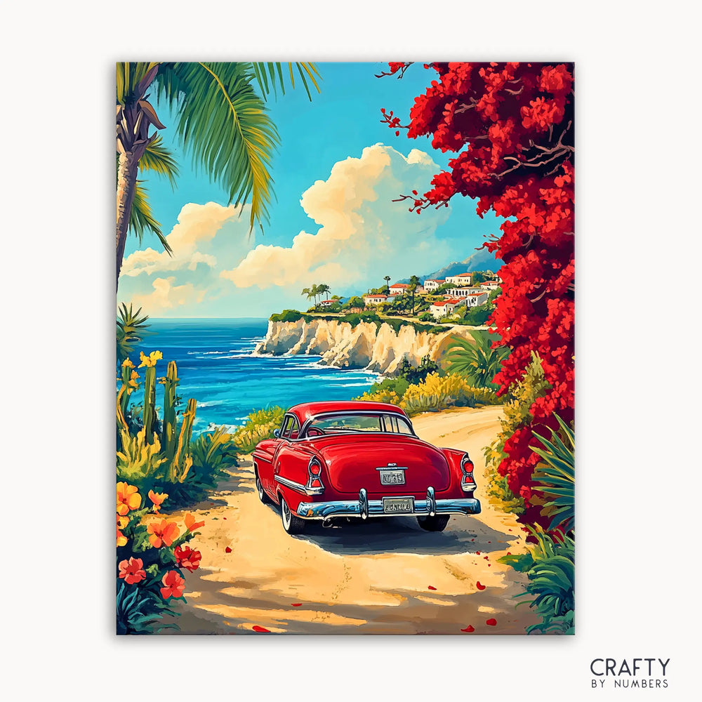 A vibrant painting depicting a red vintage car driving on a road with bougainvillea flowers on the side, leading to a coastal landscape with cliffs and the sea.