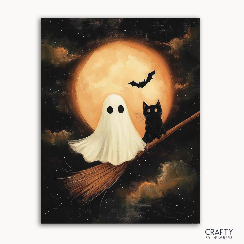 A paint by numbers kit depicting a friendly ghost and a mischievous black cat sharing a broomstick under a glowing full moon with a bat in the background.