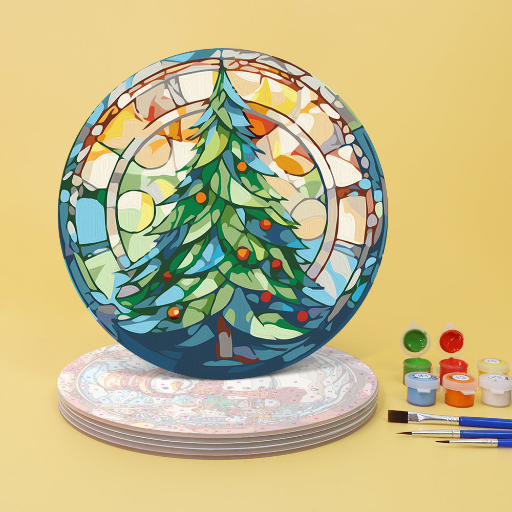 A set of paint-by-numbers placemats with a Christmas tree design, accompanied by paint brushes and colors.