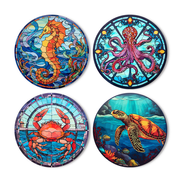 A set of four round placemats featuring vibrant sea life designs, including a seahorse, octopus, crab, and turtle, each in a stained-glass style.