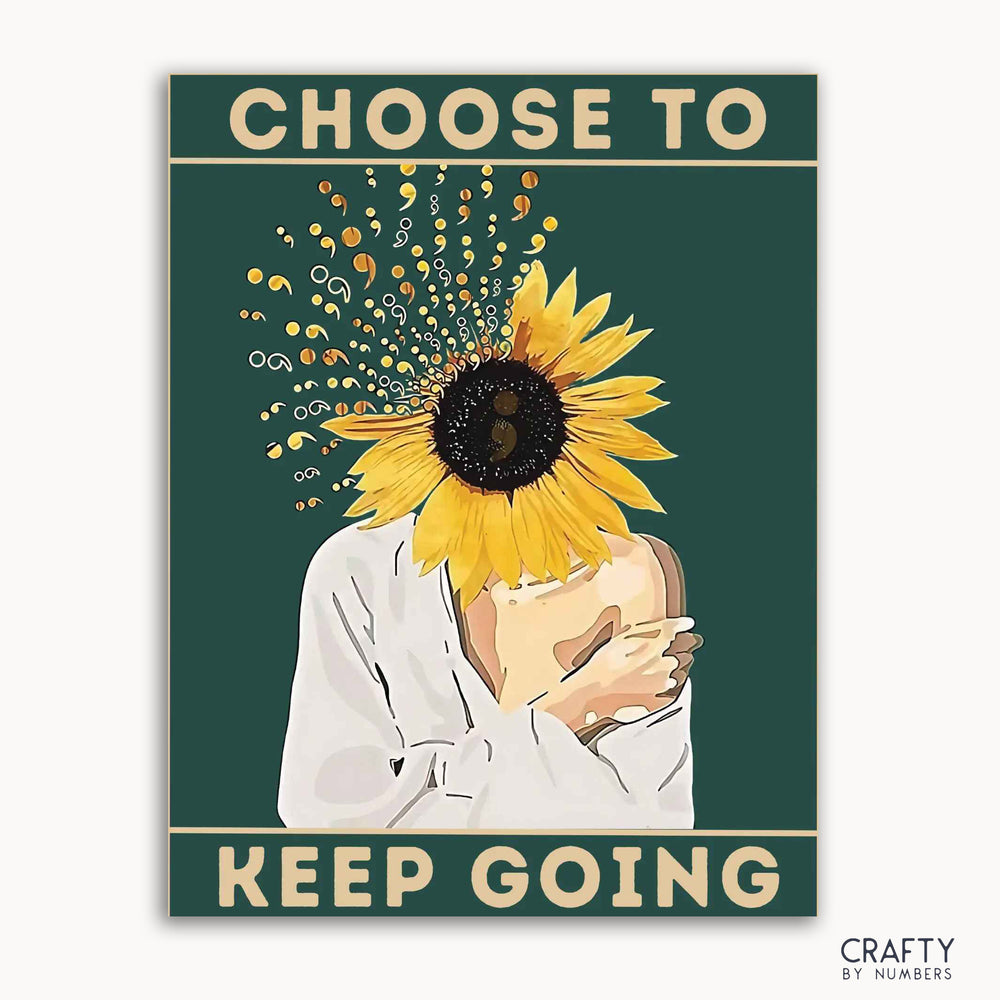 A paint-by-numbers kit with a design of a person hugging a sunflower with the words 'CHOOSE TO KEEP GOING' written at the top.