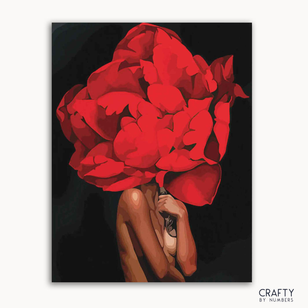 A paint-by-numbers kit canvas featuring a person with a red floral headdress against a black background.