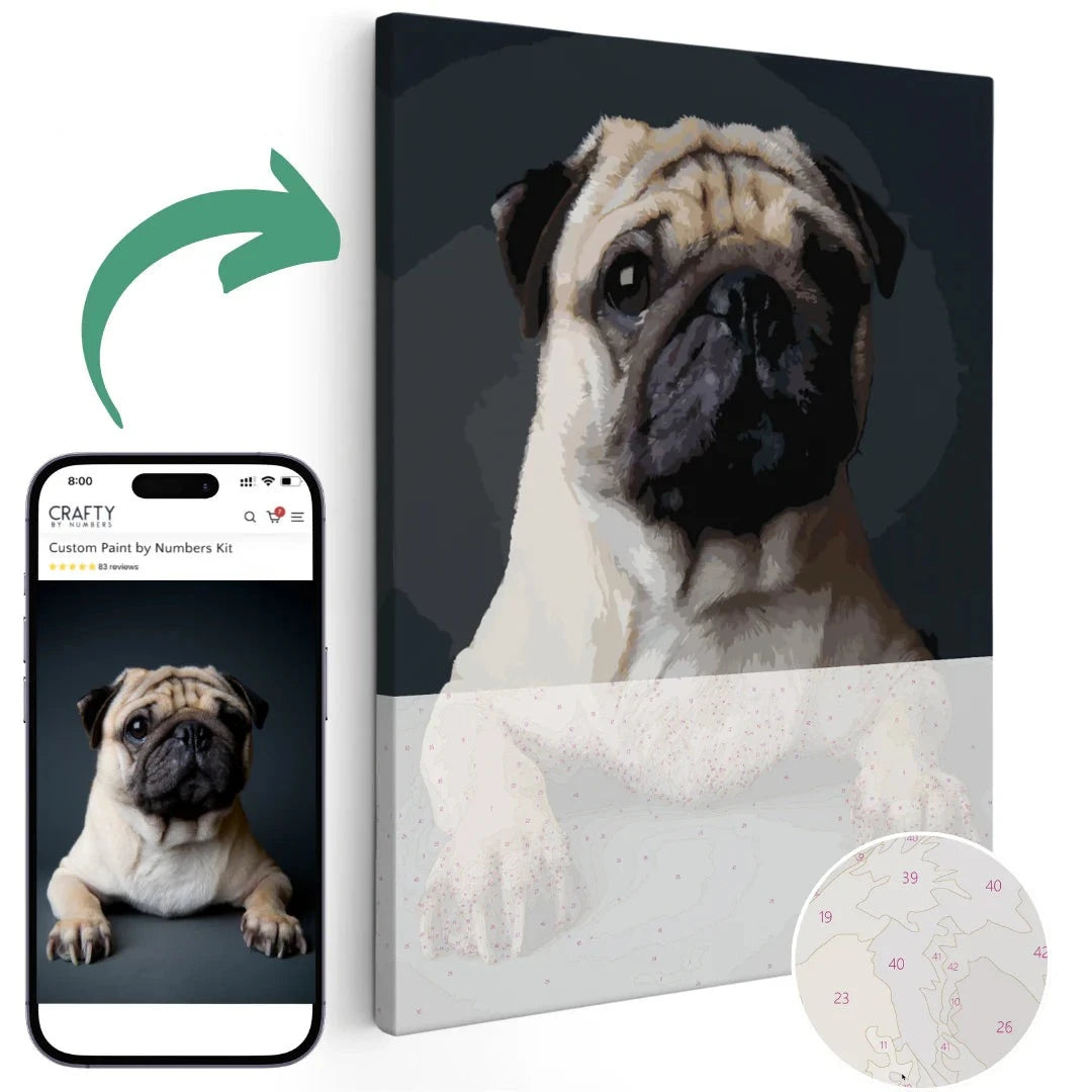 A custom paint-by-numbers kit with a photo of a pug dog on the canvas, along with a smartphone showing a close-up of the dog's face.