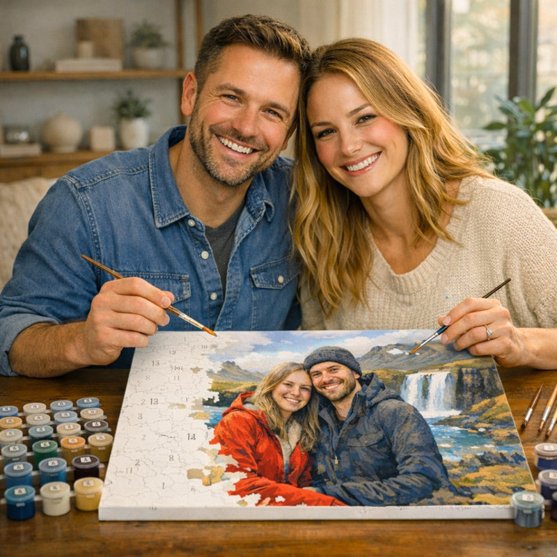 Couple smiling with a custom paint by numbers kit of their trip in Iceland