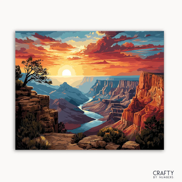 A paint by numbers kit depicting a fiery sunset over a canyon landscape with cliffs and a winding river.