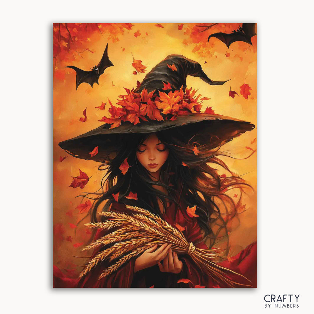 Un kit de pintura por números que representa a un personaje caprichoso de bruja otoñal con un sombrero decorado con hojas, rodeado de murciélagos, sobre un fondo de colores cálidos.