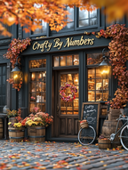 A paint-by-numbers kit depicting a cozy autumn storefront scene with pumpkins, fall foliage, and a sign reading 'Crafty By Numbers'.
