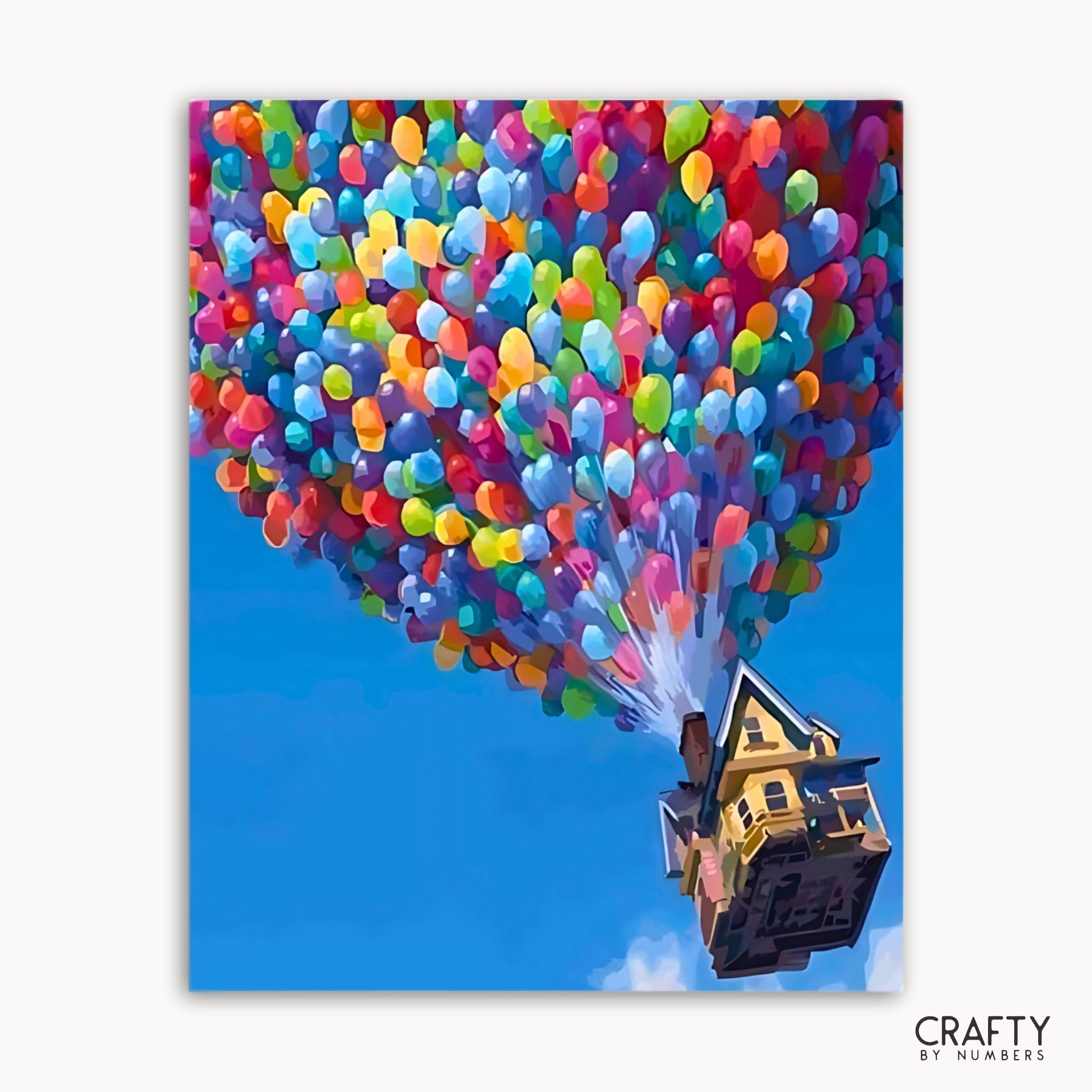 Colorful balloons lifting a house against a blue sky with 'Crafty by Numbers' branding.