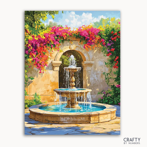 A paint-by-numbers kit depicting a vibrant Mediterranean fountain scene with a stone fountain, water, sun-kissed walls, and bougainvillea in full bloom.