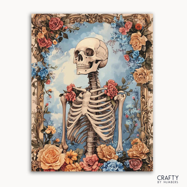 A paint by numbers kit featuring a skeleton with floral frame against a blue background, labeled 'CRAFTY BY NUMBERS'.