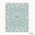 Frosted Grace Mandala Paint by Numbers kit featuring a cool-toned mandala with blue petals and flowing lines on a soft ivory background, evoking a winter bloom