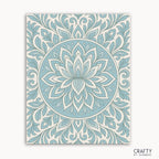 Frosted Grace Mandala Paint by Numbers kit featuring a cool-toned mandala with blue petals and flowing lines on a soft ivory background, evoking a winter bloom