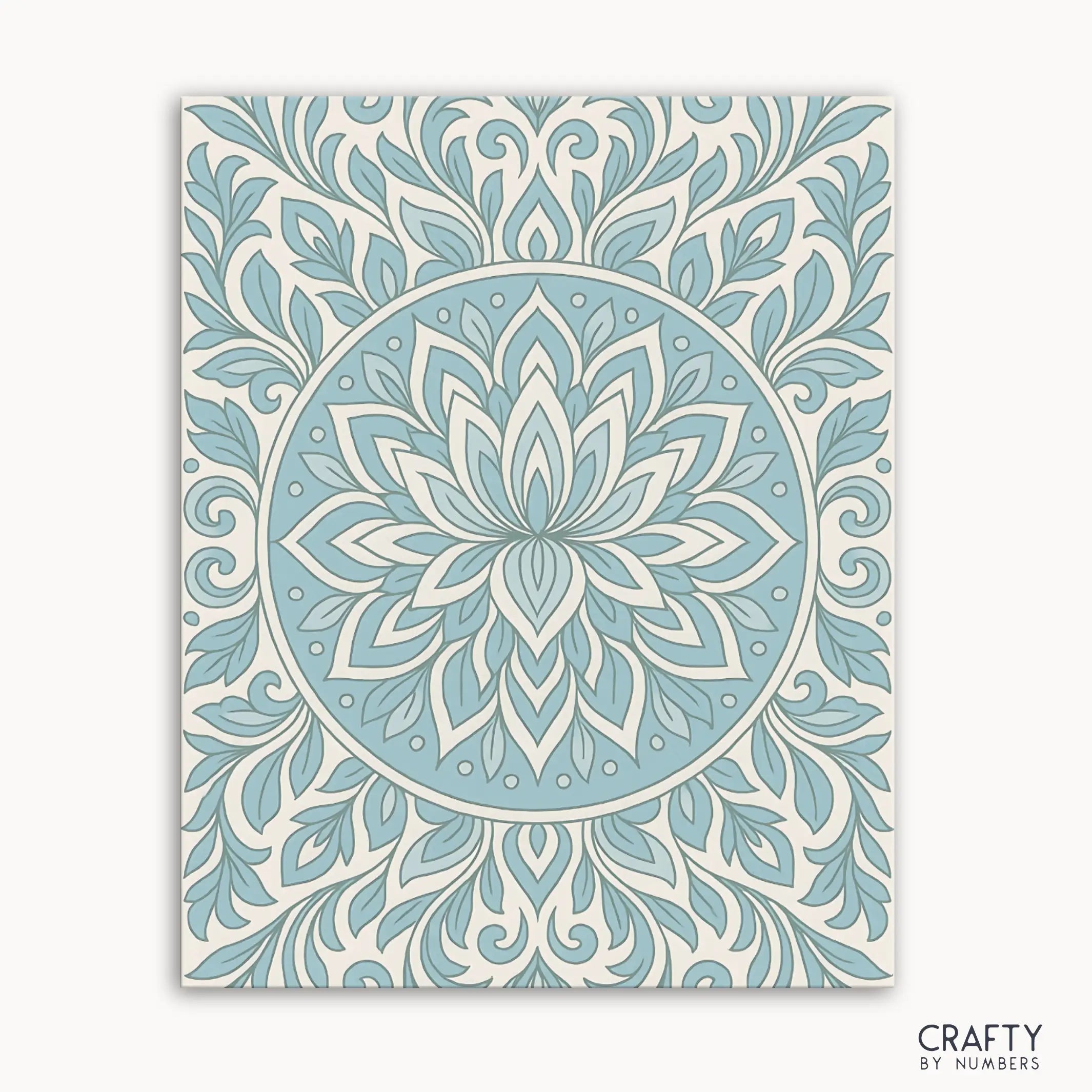 Frosted Grace Mandala Paint by Numbers kit featuring a cool-toned mandala with blue petals and flowing lines on a soft ivory background, evoking a winter bloom