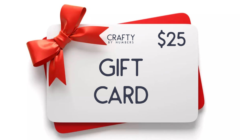 A white gift card with the words 'GIFT CARD' printed in bold letters, tied with a red ribbon.