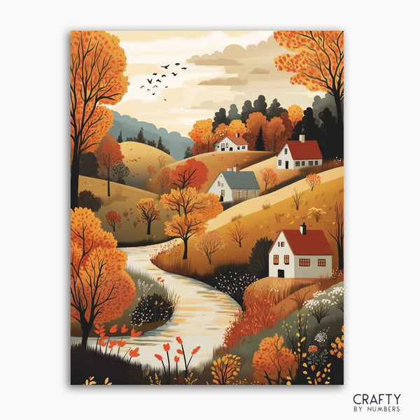 A paint-by-numbers kit depicting a village scene with autumn colors, including trees with orange leaves, a winding stream, and several houses.