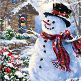 Christmas paint by numbers kit with snowman, winter cabin and festive snowy scene