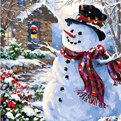 Christmas paint by numbers kit with snowman, winter cabin and festive snowy scene