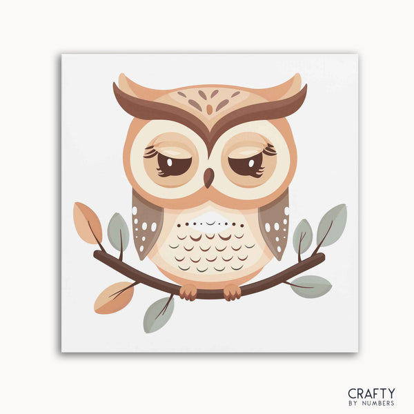 A paint-by-numbers kit depicting a brown owl perched on a branch with leaves, against a white background.