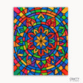Kaleido Glow Mandala Paint by Numbers kit featuring a bold mandala design bursting with vibrant rainbow hues and crisp stained-glass style lines creating a glowing, colorful mosaic