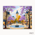 Colorful painting of a European street scene with cherry blossom trees and a clock tower.