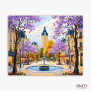 Colorful painting of a European street scene with cherry blossom trees and a clock tower.