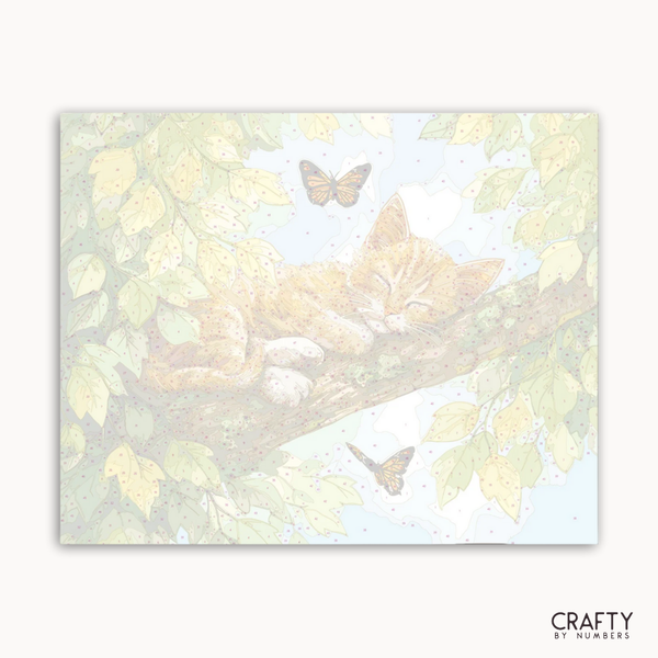 Illustration of a cat lying on a branch with butterflies in a nature-themed design, featuring the brand 'Crafty by Numbers'.
