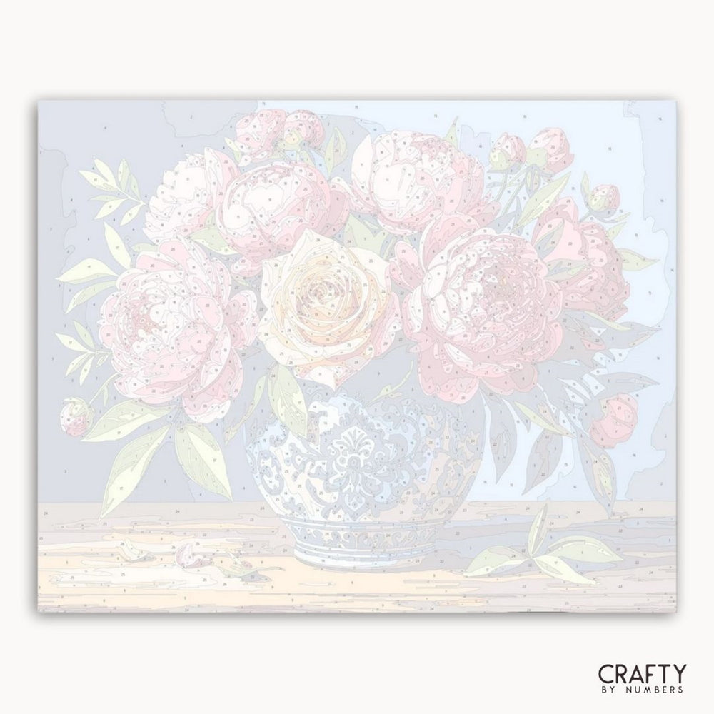 Floral design with pink flowers in a clear vase on a light blue background, branded 'Crafty by Numbers'.