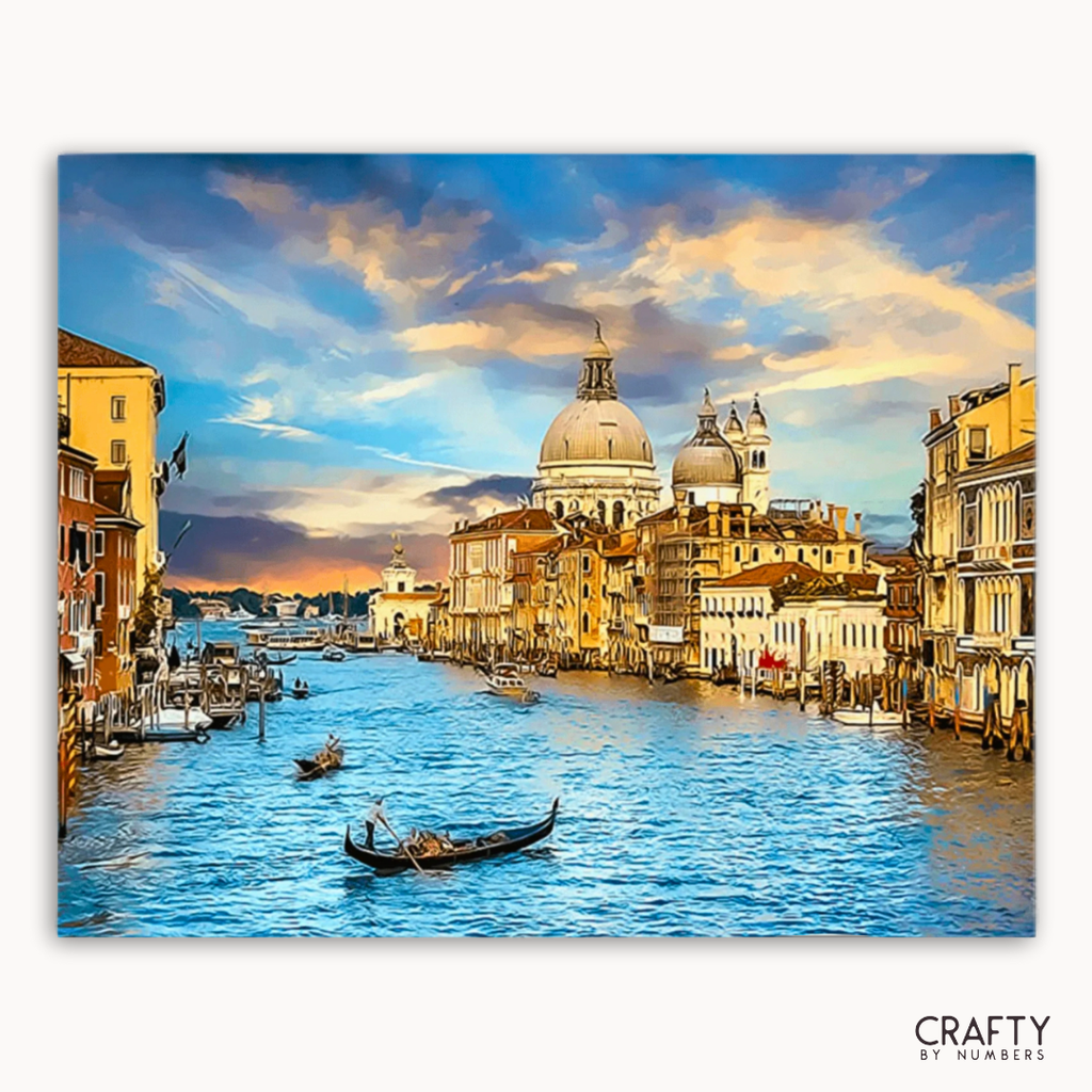 Venice cityscape with gondolas on the Grand Canal at sunset, featuring the Basilica di Santa Maria della Salute.