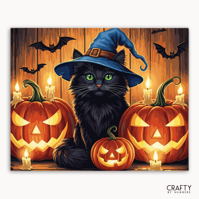 Halloween-themed painting with a black cat wearing a blue witch hat, surrounded by pumpkins and bats.