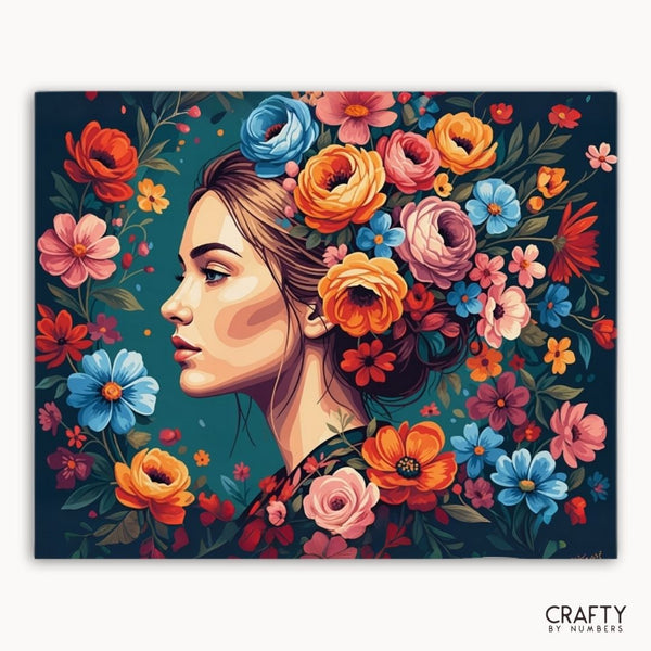 Artistic depiction of a woman's face surrounded by colorful flowers on a dark blue background, with 'Crafty by Numbers' branding.