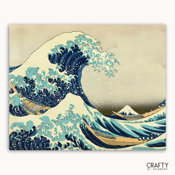 Famous artwork of a large wave with Mount Fuji in the background, featuring the brand 'Crafty by Numbers'.collection