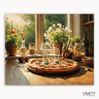 Pizza sobre una mesa de madera con una ventana y plantas al fondo, con la marca 'Crafty by Numbers'.
