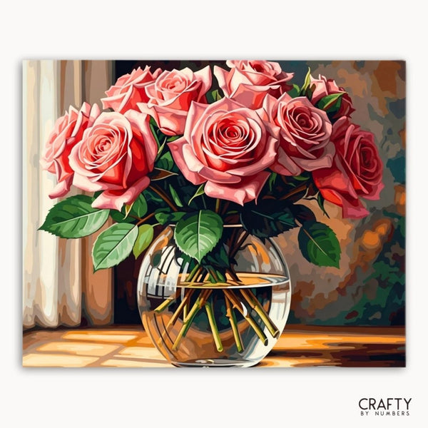 Bouquet of pink roses in a clear vase with a blurred background