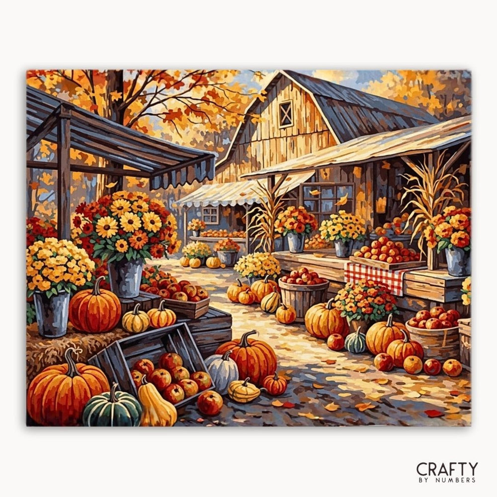 Autumnal scene with pumpkins, apples, and flowers in front of a barn, featuring the brand 'Crafty by Numbers'.