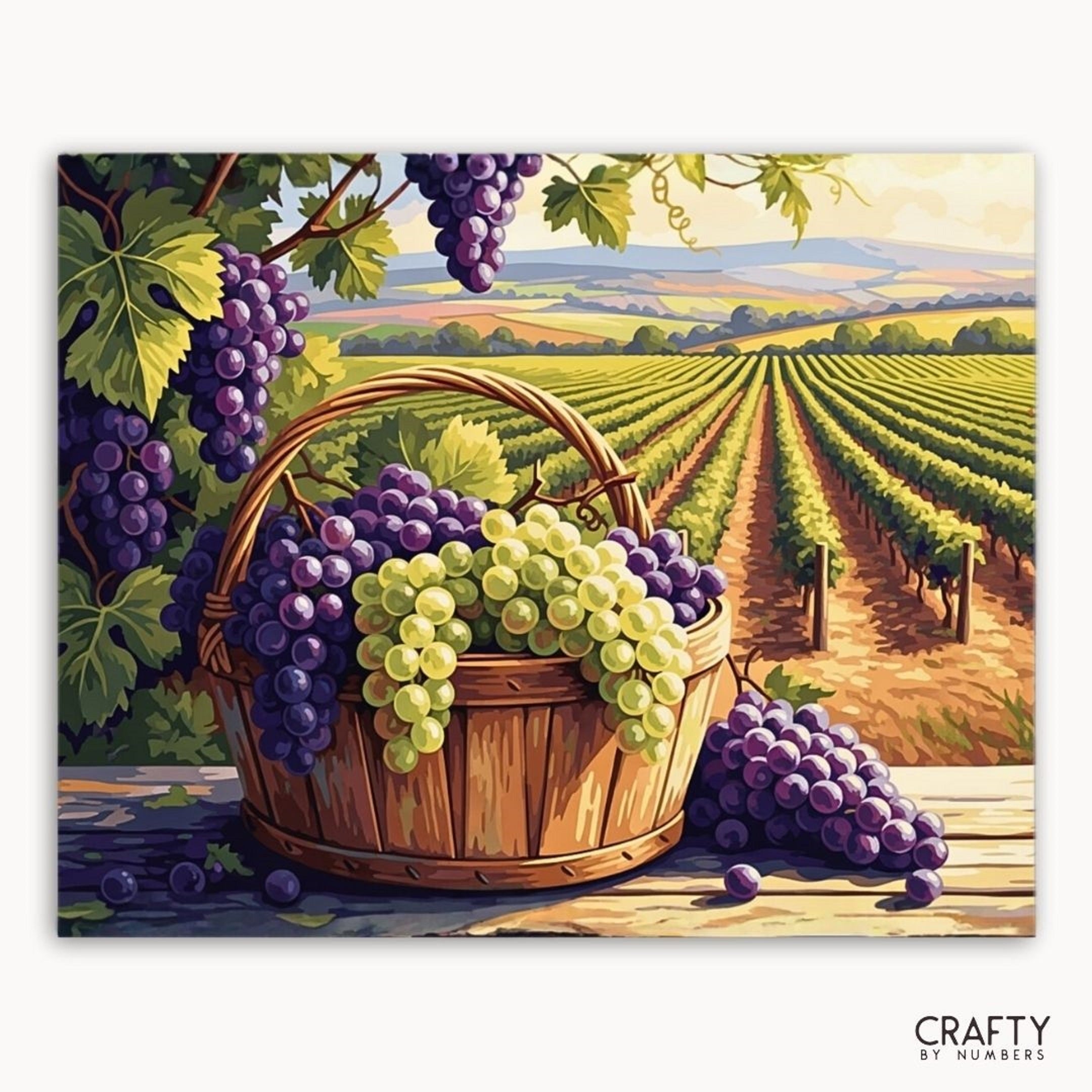 Painting of a basket of grapes with a vineyard in the background, featuring the brand 'Crafty by Numbers'.