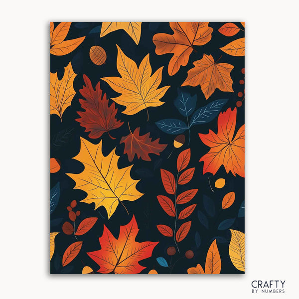 A paint-by-numbers canvas with a pattern of vibrant autumn leaves in gold, crimson, and orange against a dark background, labeled 'CRAFTY BY NUMBERS'.
