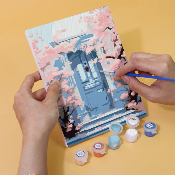 Colorful mini paint by numbers kit featuring a blooming doorway with flowers