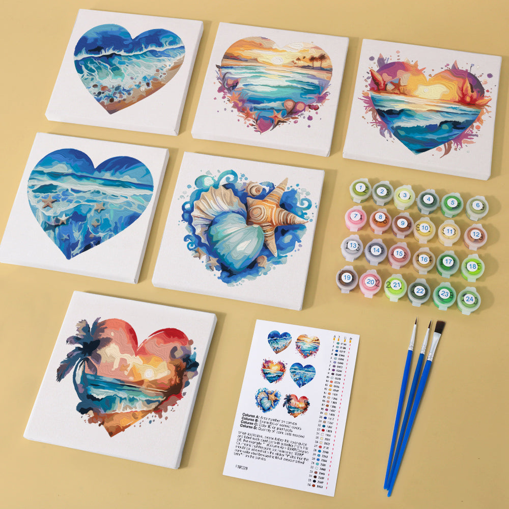 Kit components including paint pots, numbered brush, and canvas of coastal scene