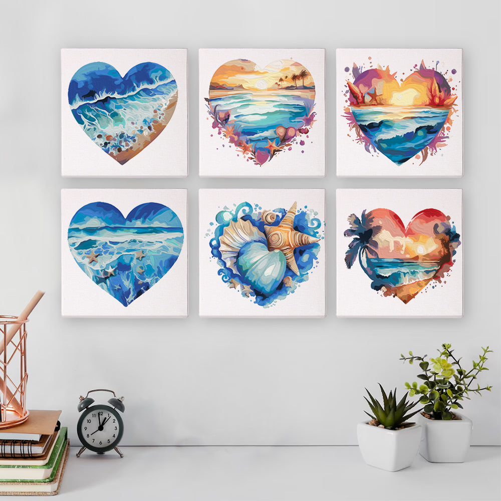 Painting kit laid out on table with brush, paints, and numbered coastal canvas