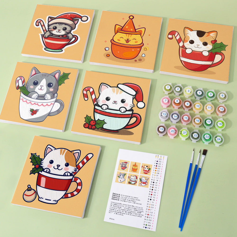 Cute kitten curled up in a teacup for painting project
