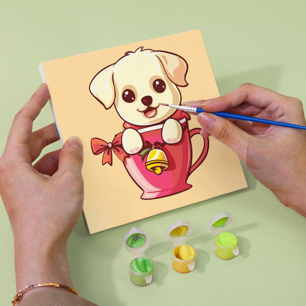 Cute puppies in a cozy cup ready for painting