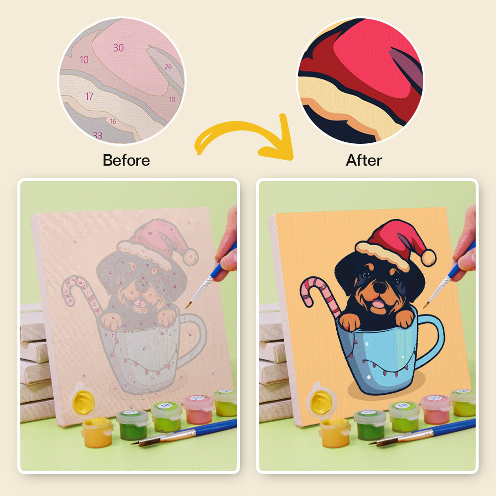 Miniature artwork of puppies snuggled in a cup