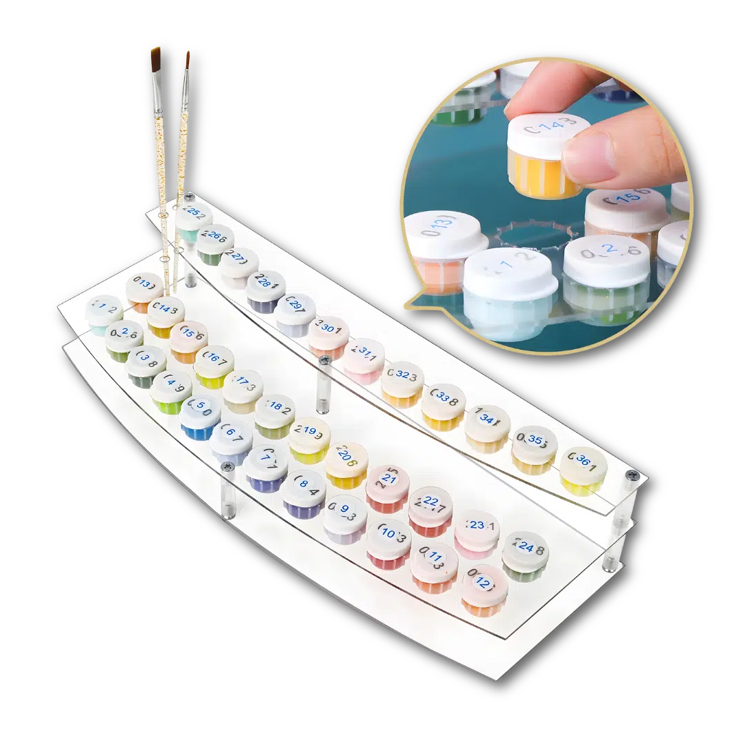 Set of watercolor paint pots with a clear acrylic tray and brushes on a white background.