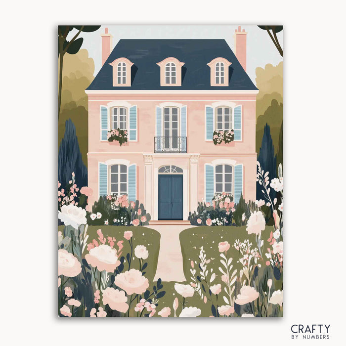 A paint-by-numbers kit depicting a vibrant meadow with colorful flowers and a pink house with blue shutters in the background.