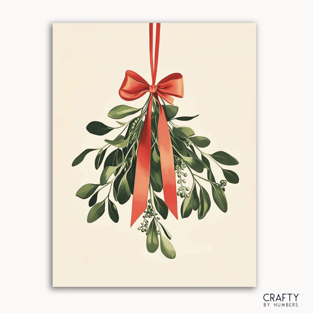 A paint by numbers kit depicting a mistletoe sprig with a vibrant red ribbon at the top, against a white background, with the brand 'CRAFTY BY NUMBERS' visible.