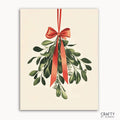A paint by numbers kit depicting a mistletoe sprig with a vibrant red ribbon at the top, against a white background, with the brand 'CRAFTY BY NUMBERS' visible.