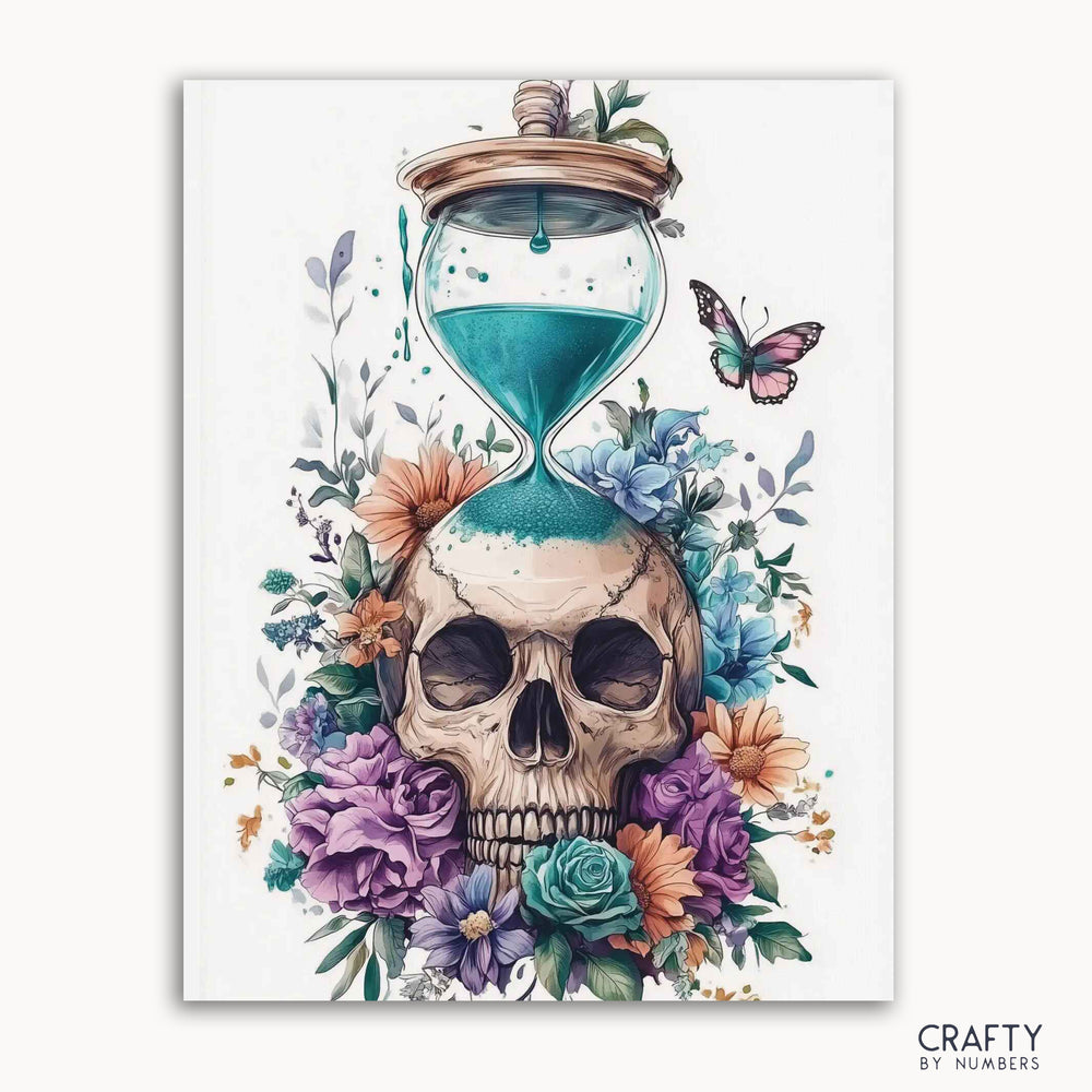 A paint by numbers kit image featuring a skull with floral arrangements and an hourglass, with vibrant colors and a butterfly