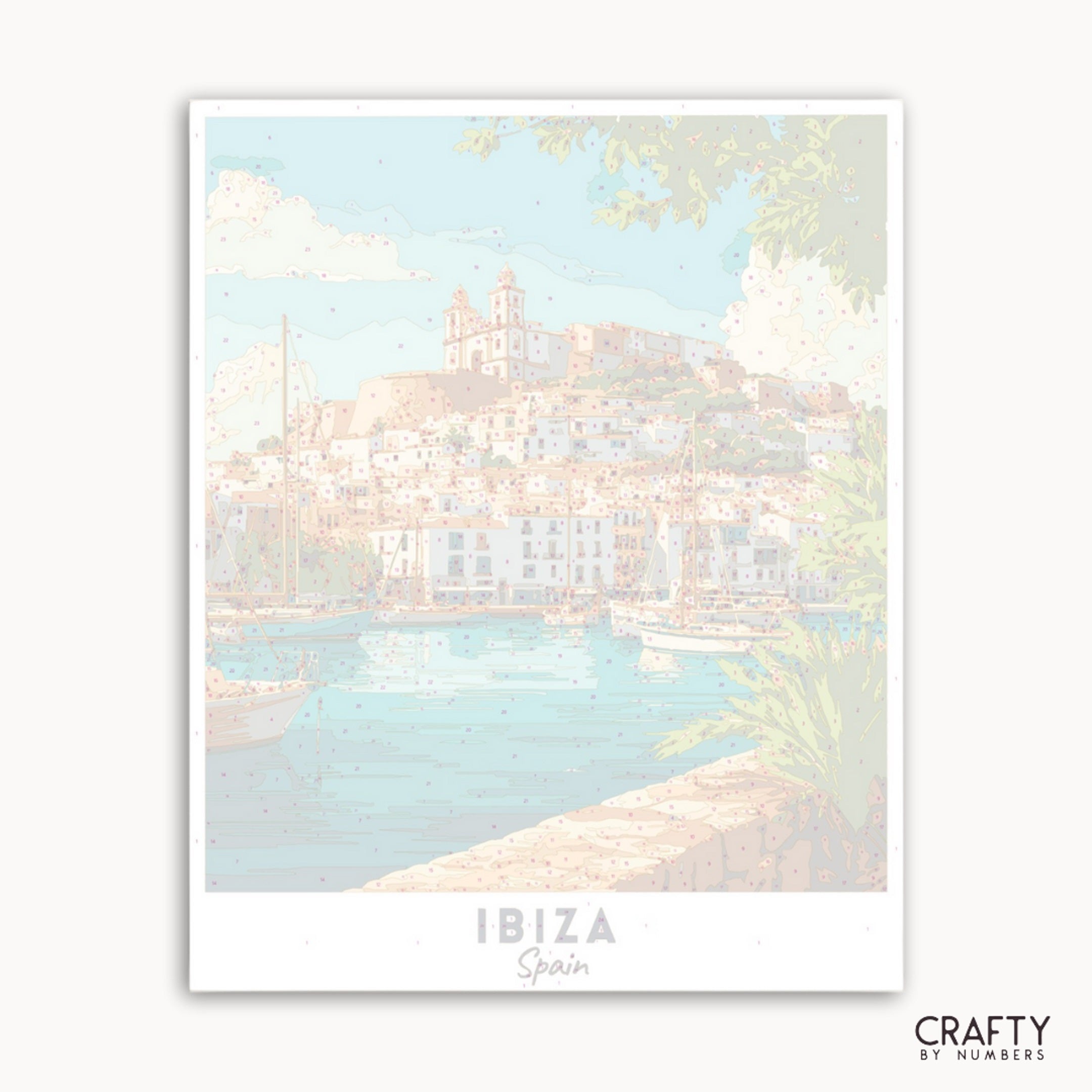 Framed artwork of a coastal scene with 'Ibiza, Spain' text and 'Crafty by Numbers' branding.