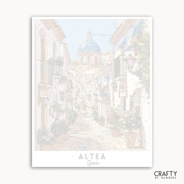 Framed artwork of a scenic view with 'Altea, Spain' text on a white background