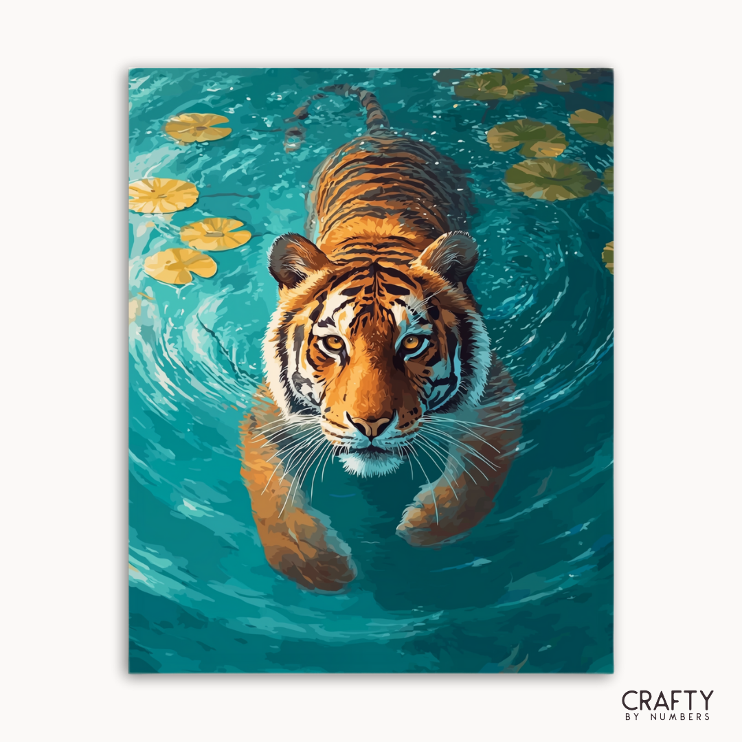 Painting of a tiger swimming in water with lily pads, brand 'Crafty by Numbers' visible.